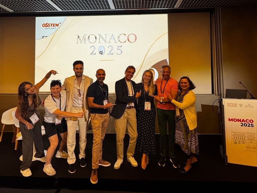 Milda Vitosytė with colleagues on stage at the EAO Congress in Monaco, 2025