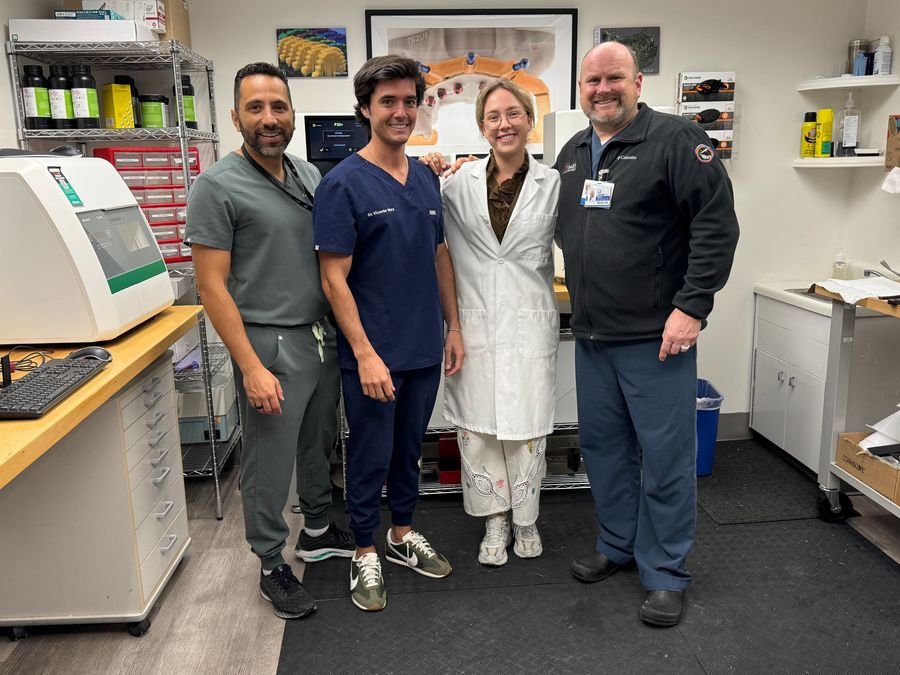 Milda Vitosytė with members of the University of Florida dental team